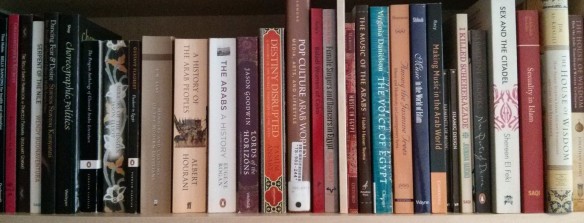 A shelf of books about Middle Eastern history, culture and music